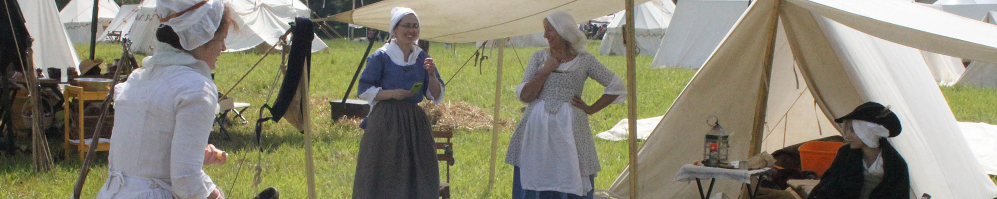 women in historic costumes