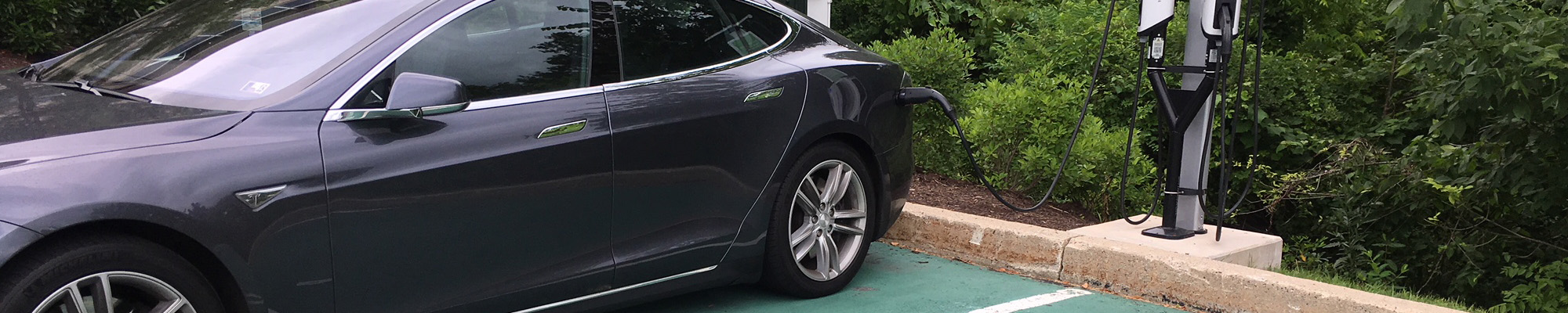 vehicle charging in designated parking spot