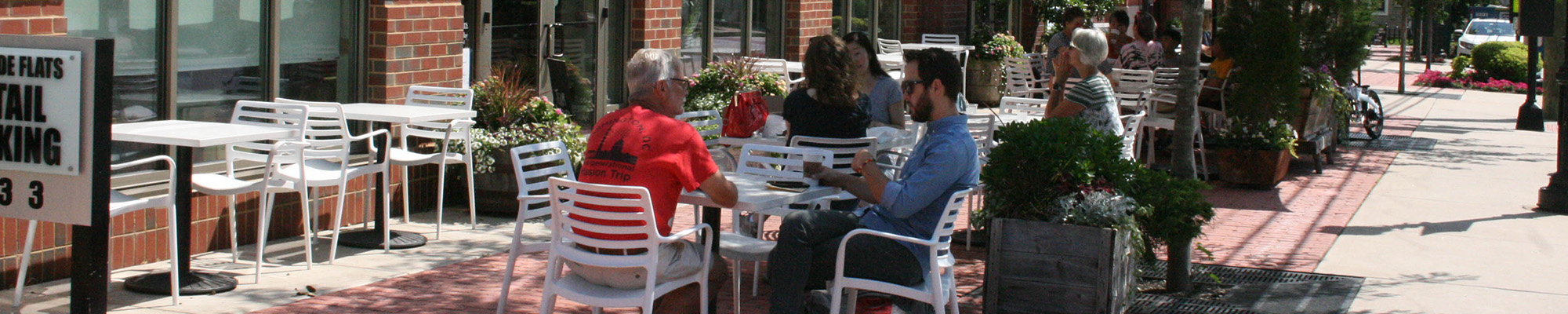 outdoor dining under shaded trees