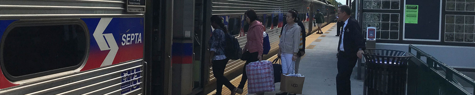 people boarding a train